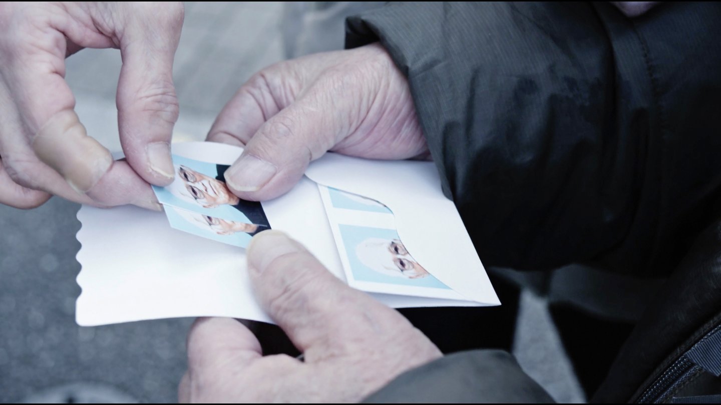 Filmstill of Masao Adachi Takes a Passport Photo